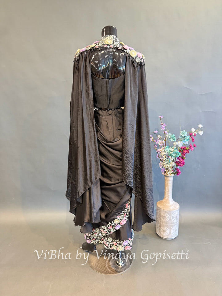 Black pre draped saree and blouse with a cape
