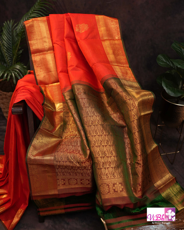 Vermilion Orange Kanchi Silk Saree with Gold Zari Weaving and Green Embroidered Blouse