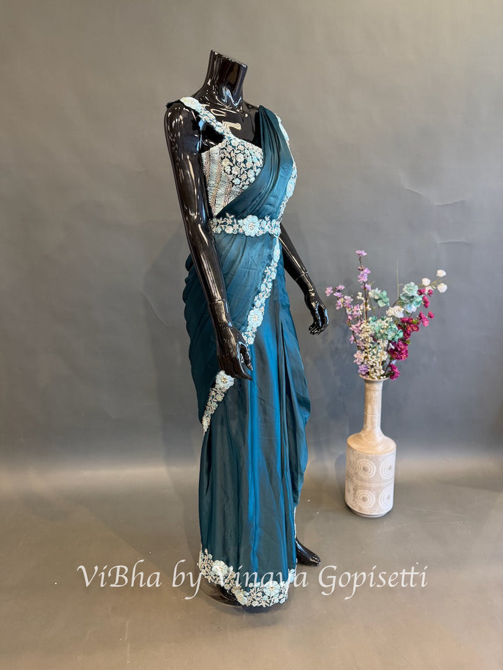 Peacock Blue pre draped saree with a sleeveless blouse