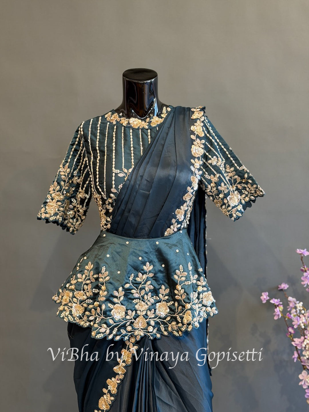 Peacock blue pre draped saree with a peplum blouse