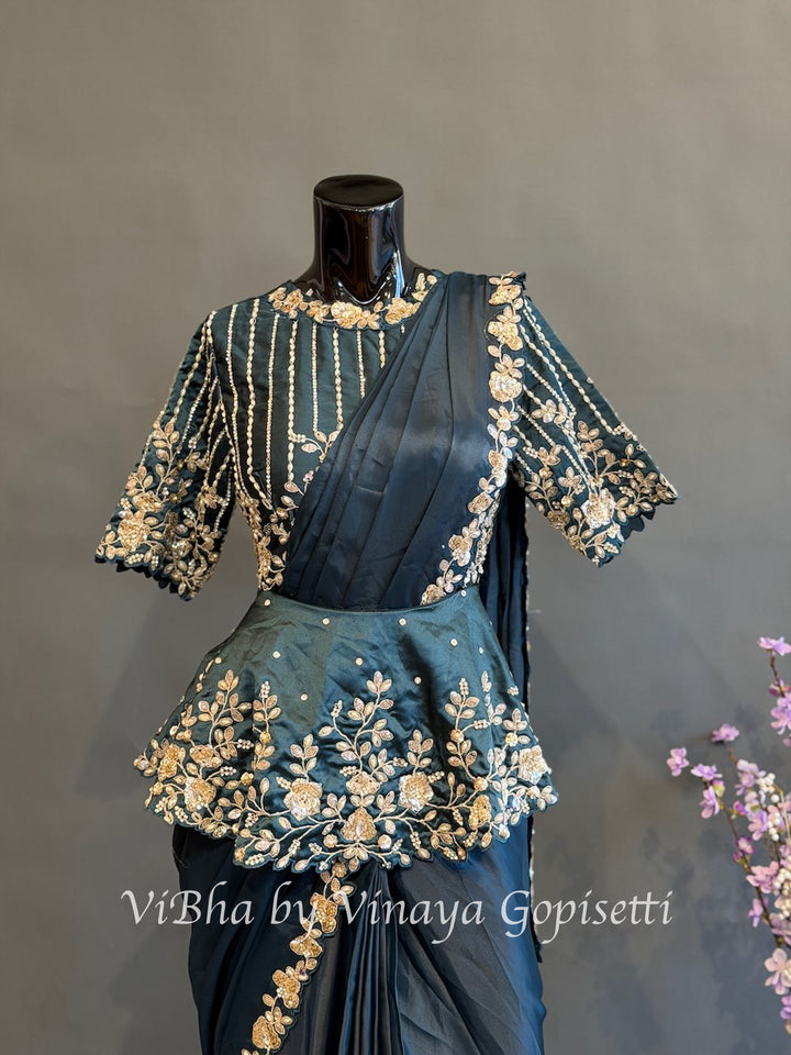 Peacock blue pre draped saree with a peplum blouse