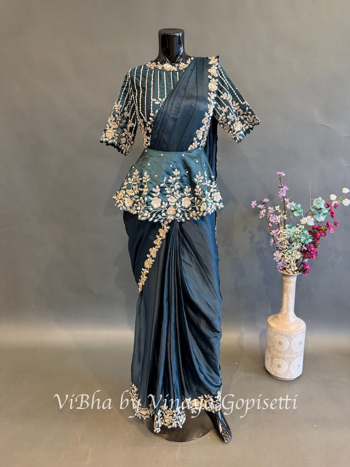 Peacock blue pre draped saree with a peplum blouse