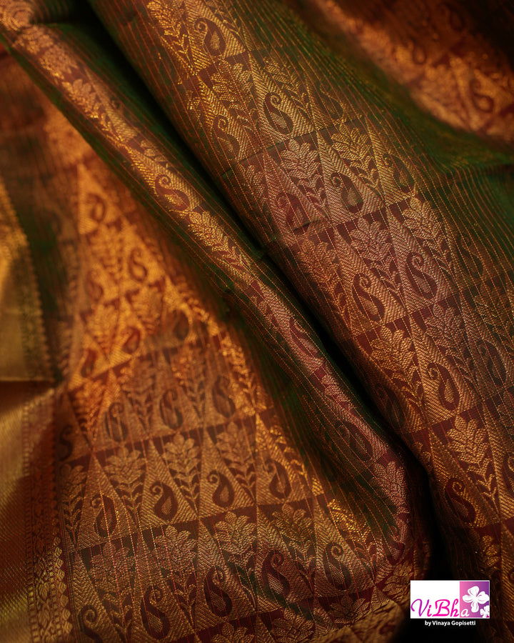 Vermilion Orange Kanchi Silk Saree with Gold Zari Weaving and Green Embroidered Blouse