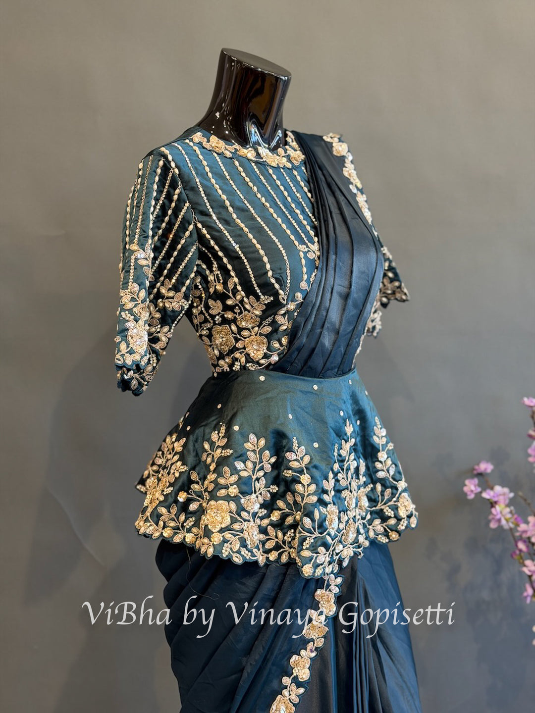 Peacock blue pre draped saree with a peplum blouse