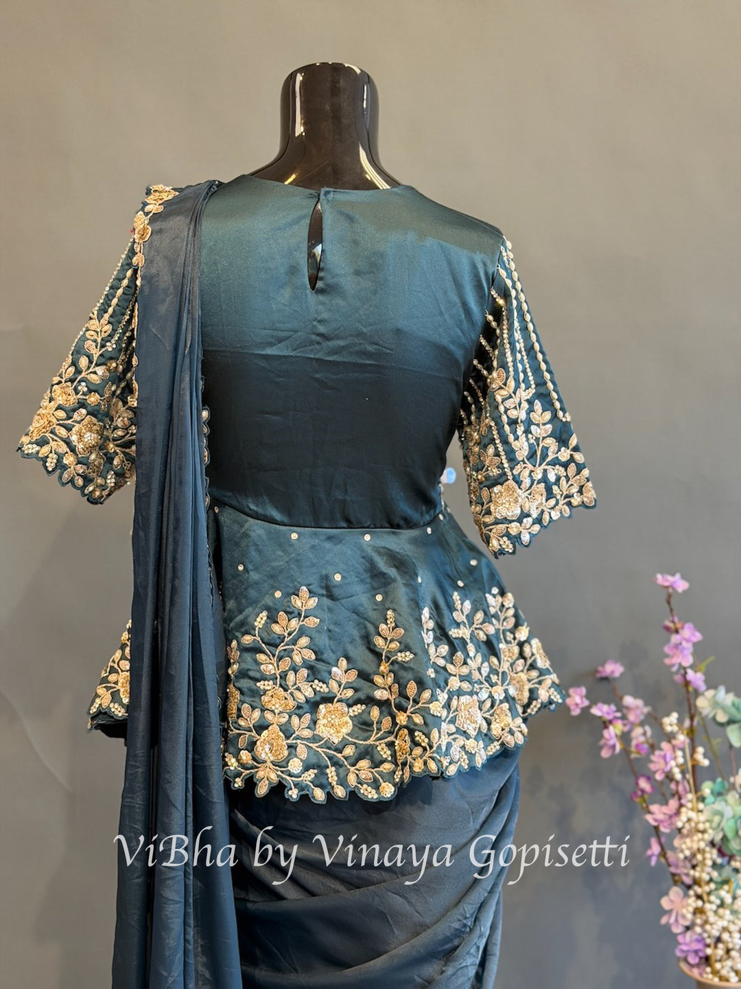 Peacock blue pre draped saree with a peplum blouse