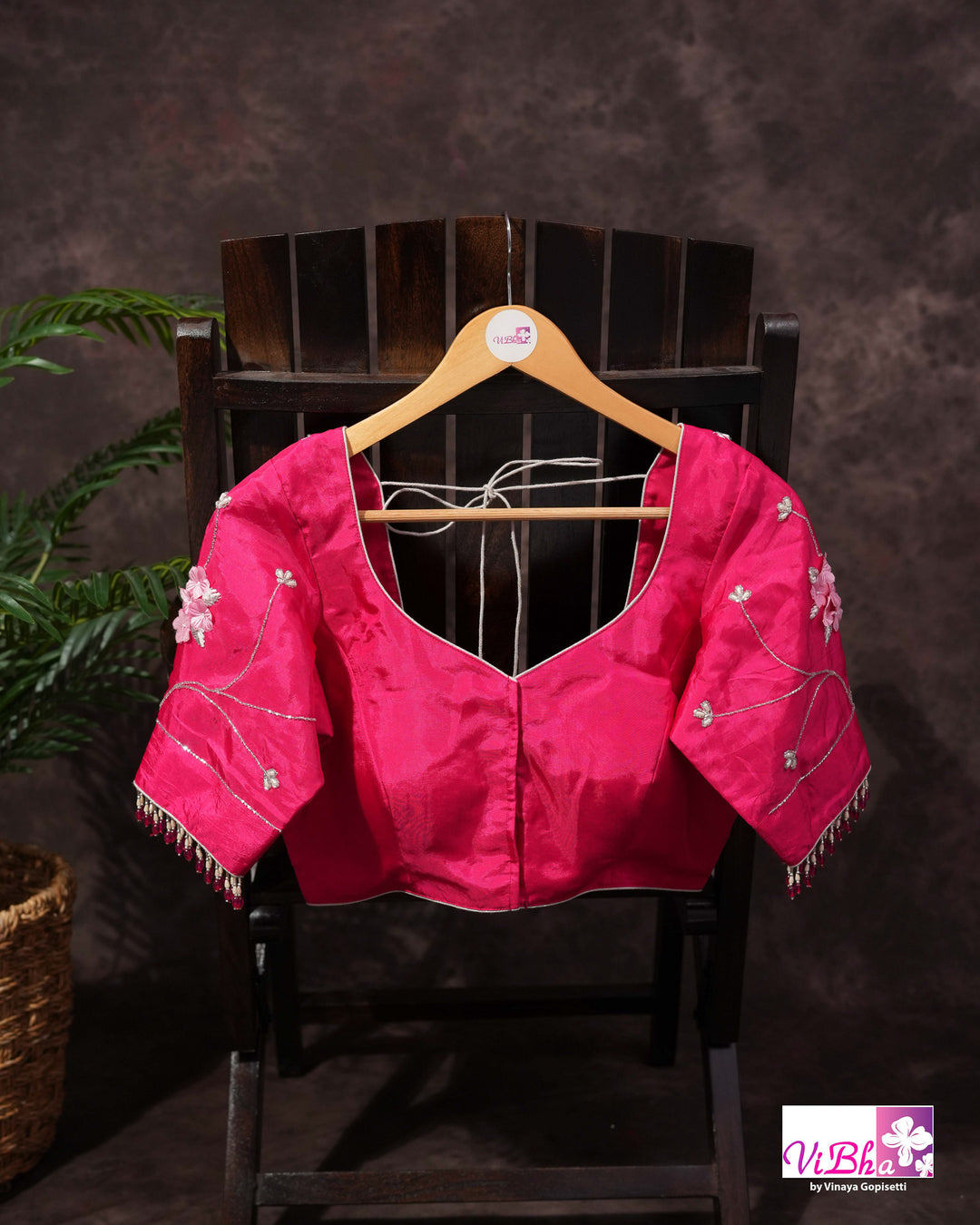 Pink Shimmer Designer Saree with Floral Detailing and Fuchsia Blouse Styling