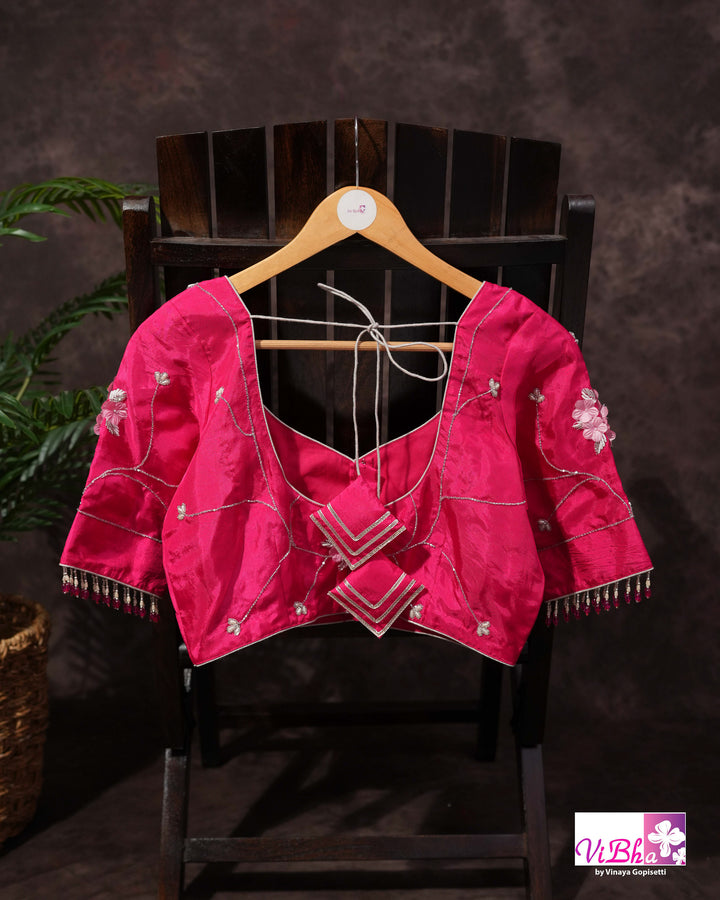 Pink Shimmer Designer Saree with Floral Detailing and Fuchsia Blouse Styling