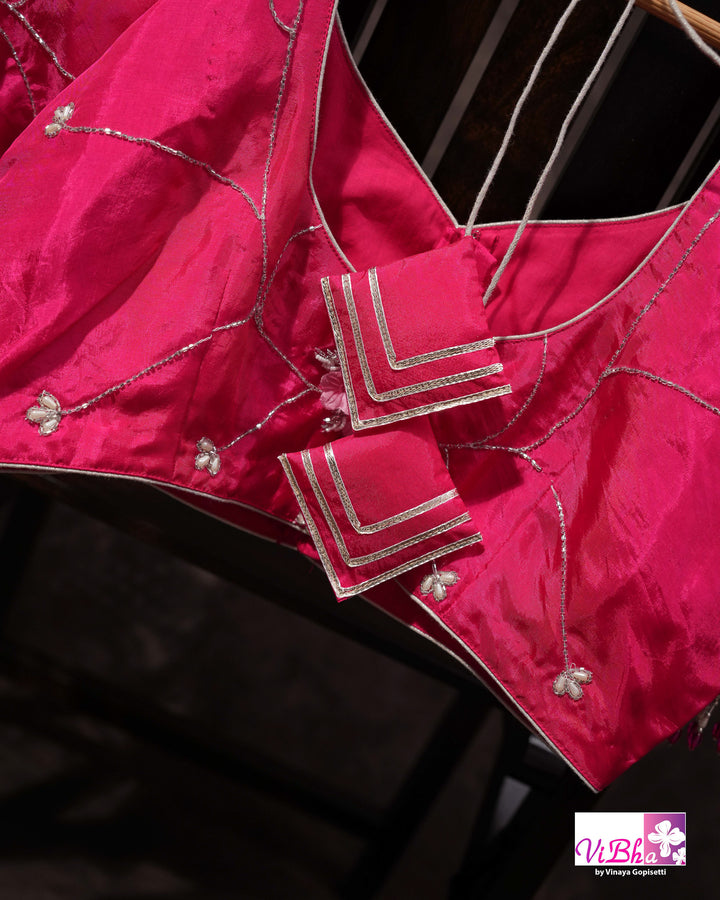 Pink Shimmer Designer Saree with Floral Detailing and Fuchsia Blouse Styling