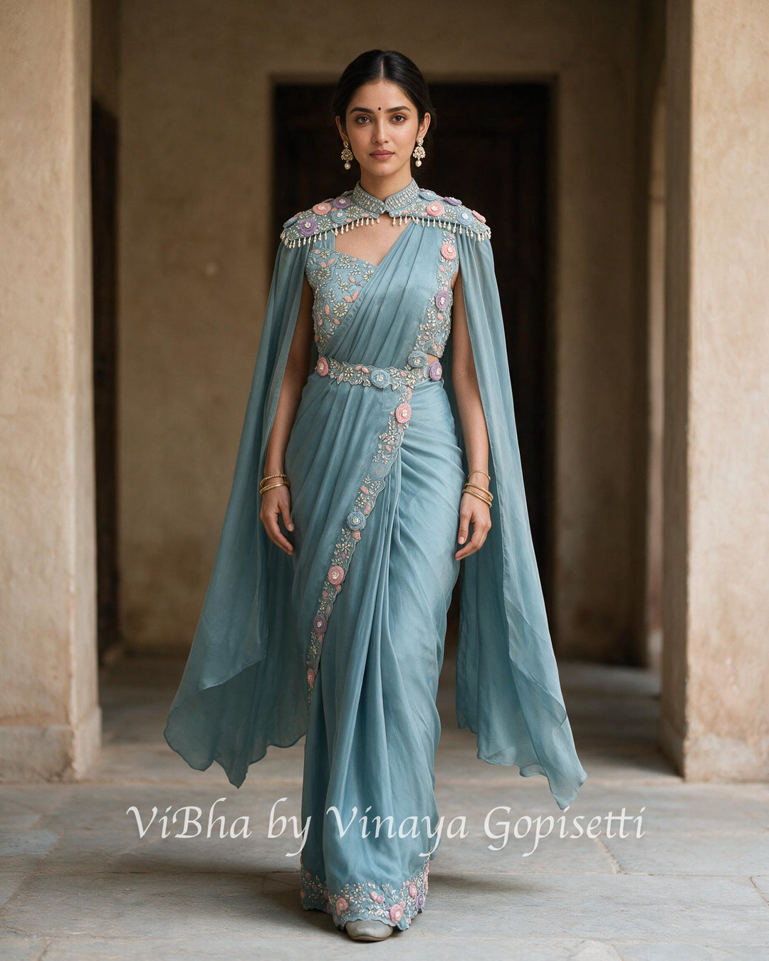 Powder blue pre draped saree and blouse with a cape