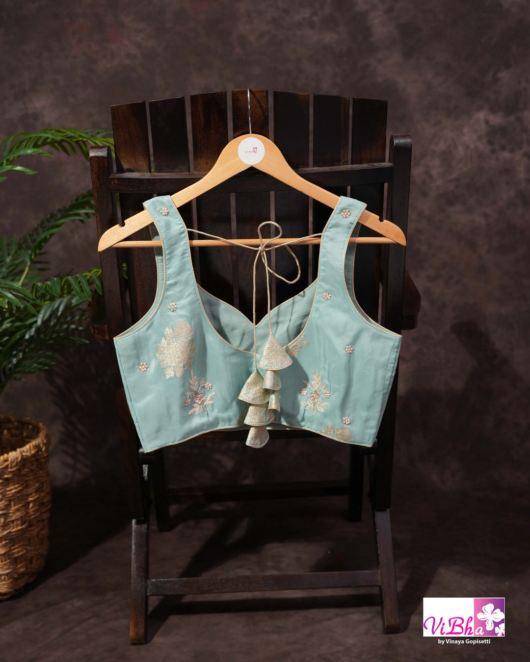 Teal Designer Saree with Floral Motifs and Embroidered Vine Border