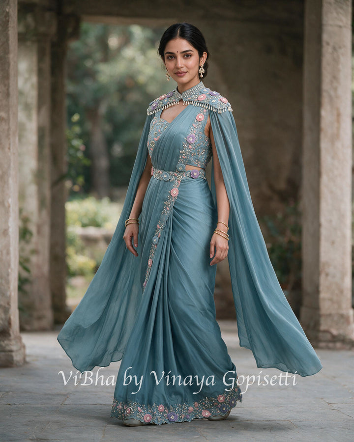 Powder blue pre draped saree and blouse with a cape