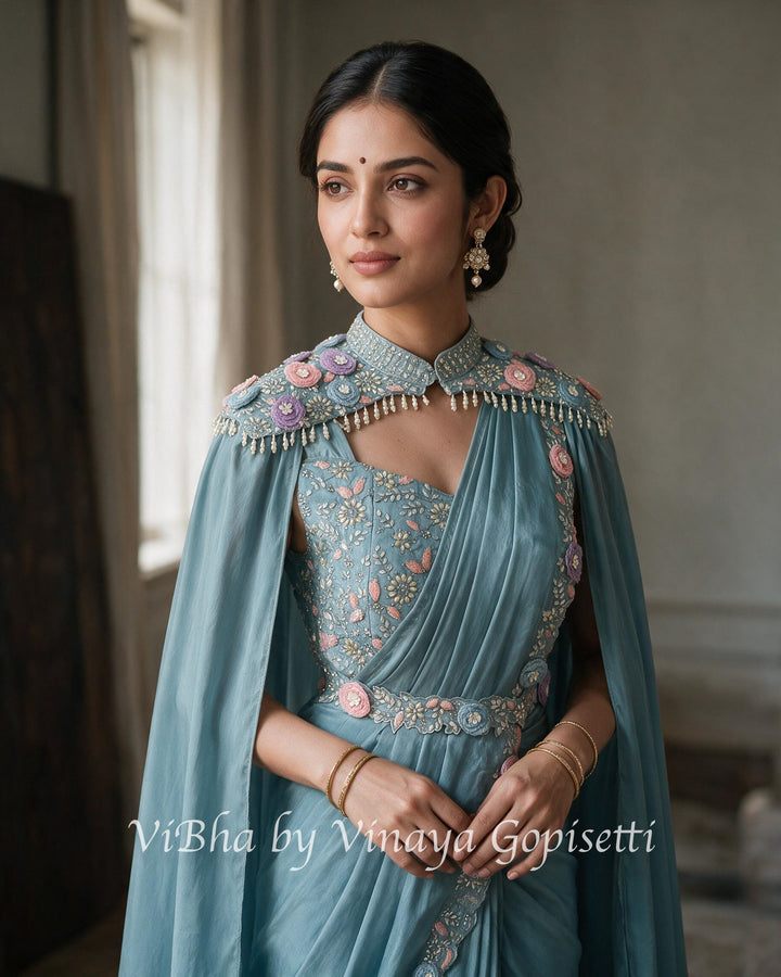 Powder blue pre draped saree and blouse with a cape
