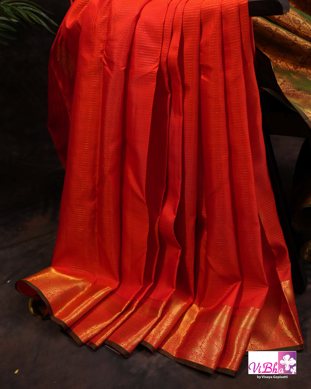 Vermilion Orange Kanchi Silk Saree with Gold Zari Weaving and Green Embroidered Blouse