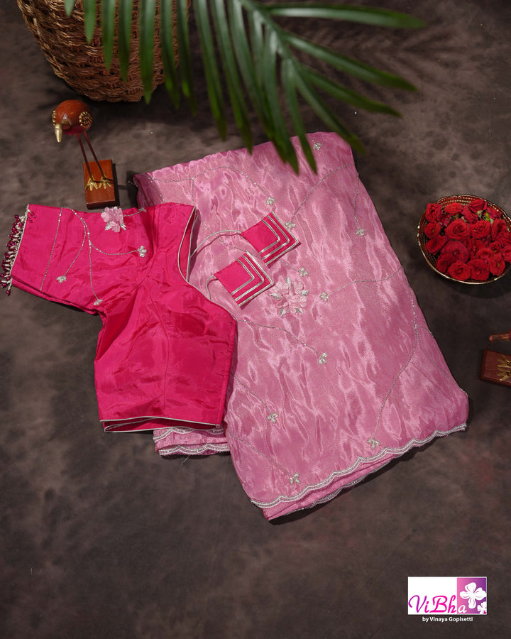 Pink Shimmer Designer Saree with Floral Detailing and Fuchsia Blouse Styling
