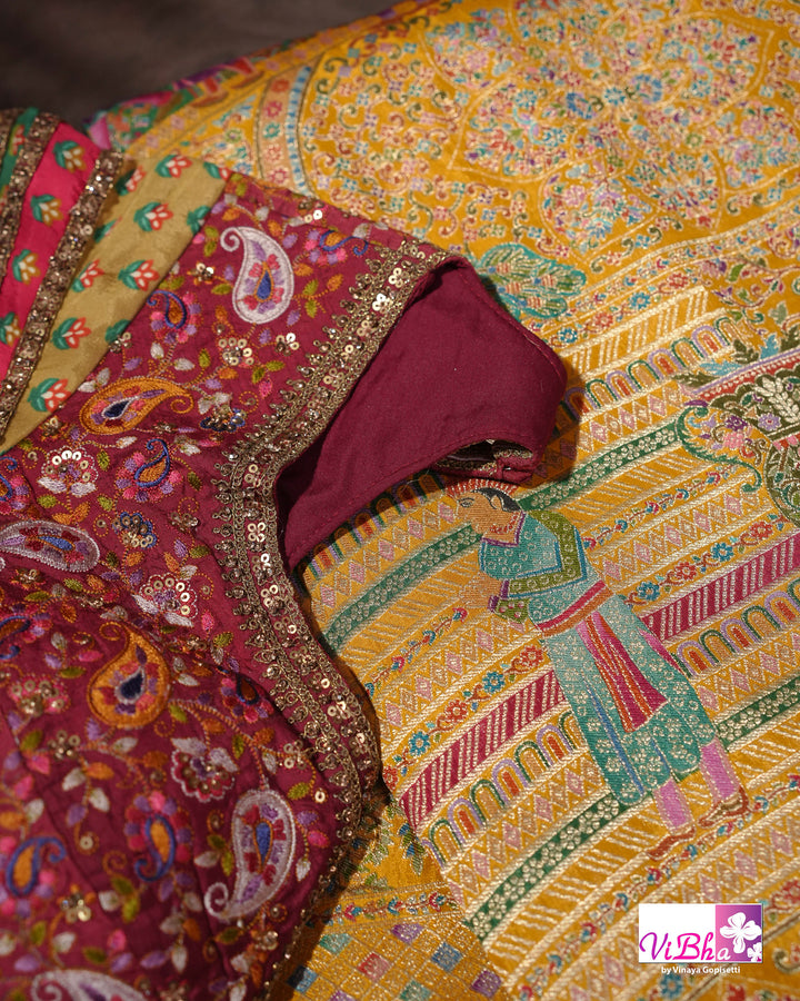Mustard Yellow Designer Saree with Multicolour Figurative Motifs and Ornate Border