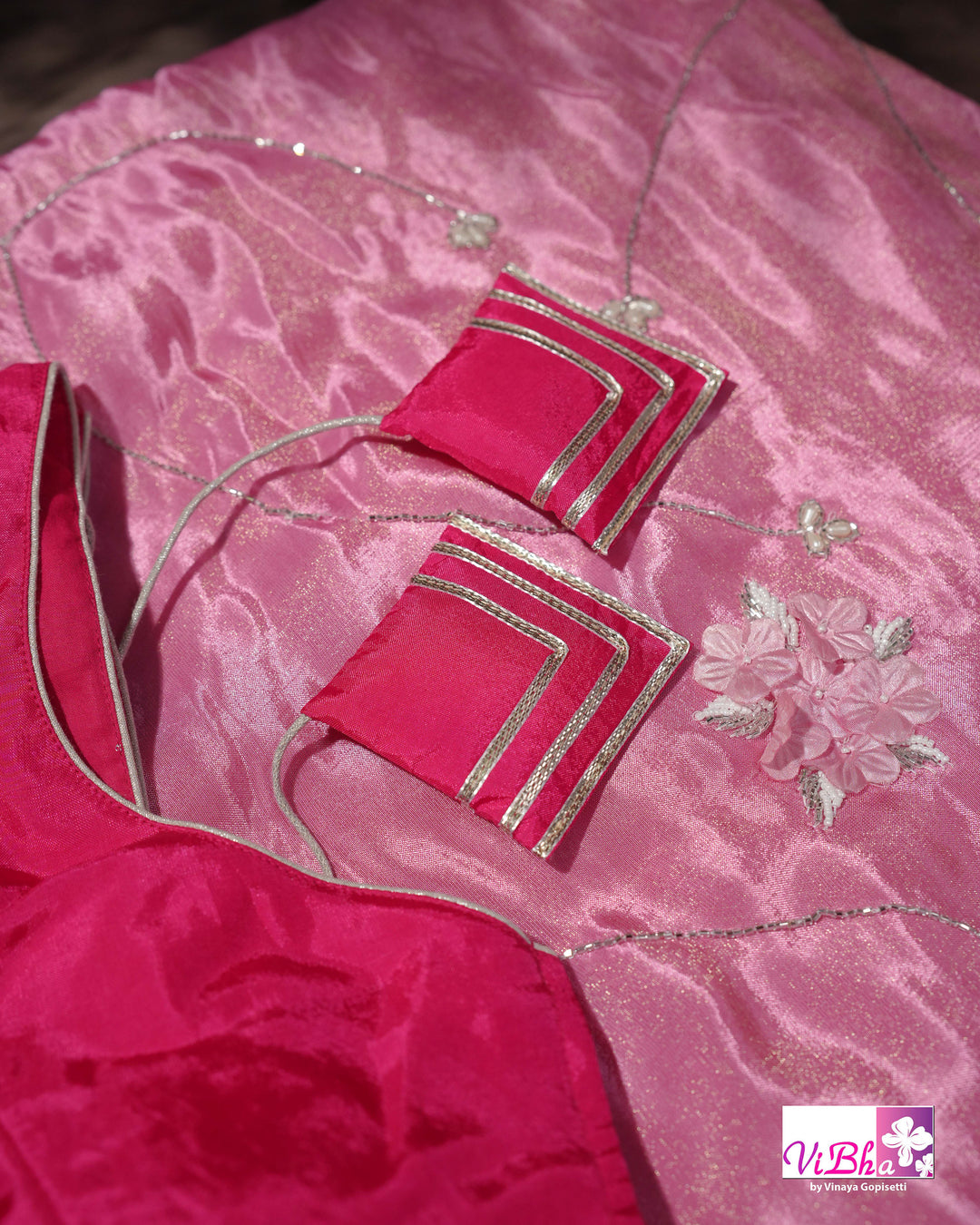 Pink Shimmer Designer Saree with Floral Detailing and Fuchsia Blouse Styling