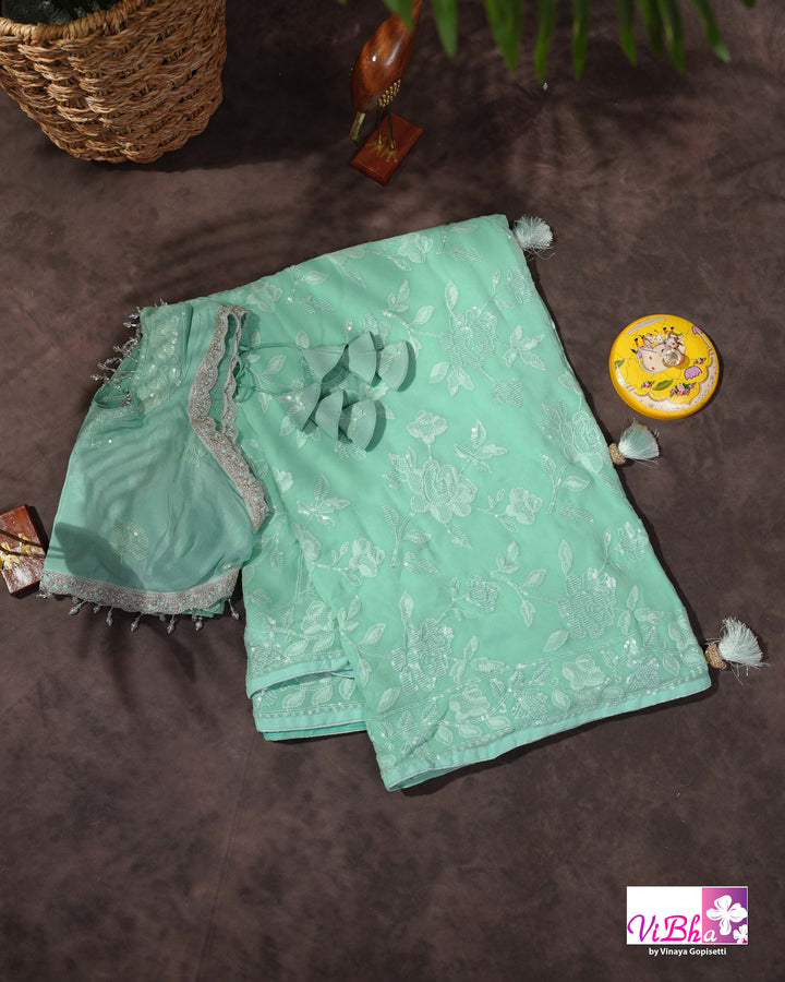 Mint Green Designer Saree with Tonal Floral Embroidery and Tassel Details