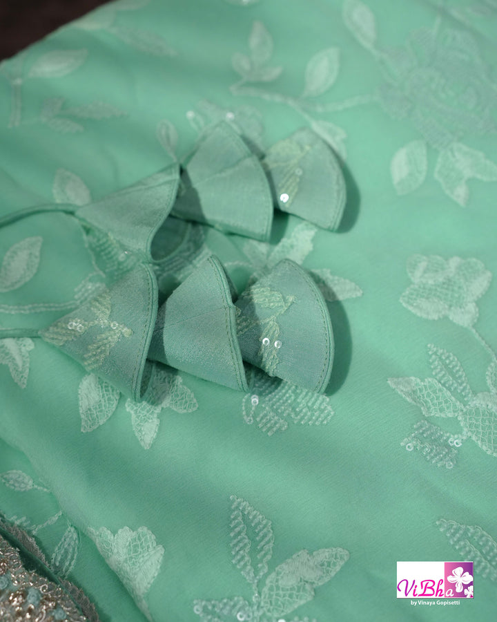 Mint Green Designer Saree with Tonal Floral Embroidery and Tassel Details