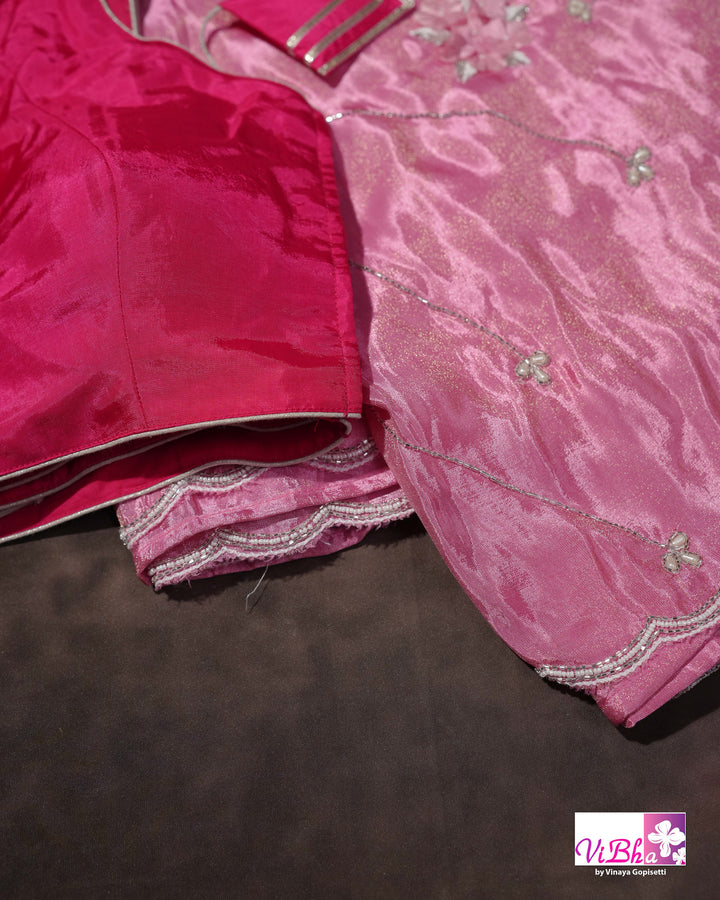 Pink Shimmer Designer Saree with Floral Detailing and Fuchsia Blouse Styling