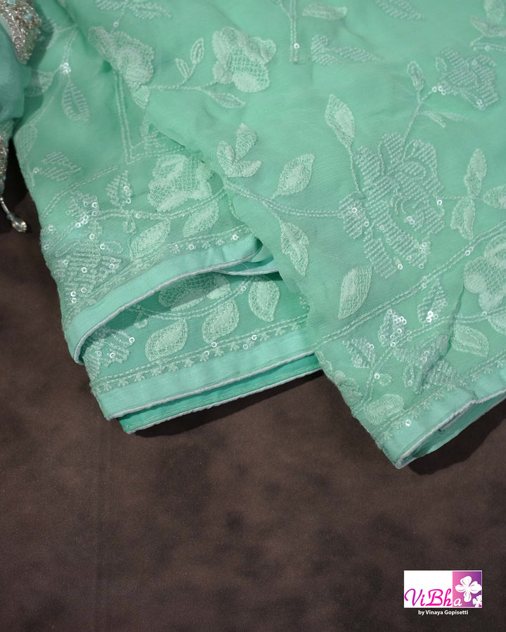 Mint Green Designer Saree with Tonal Floral Embroidery and Tassel Details