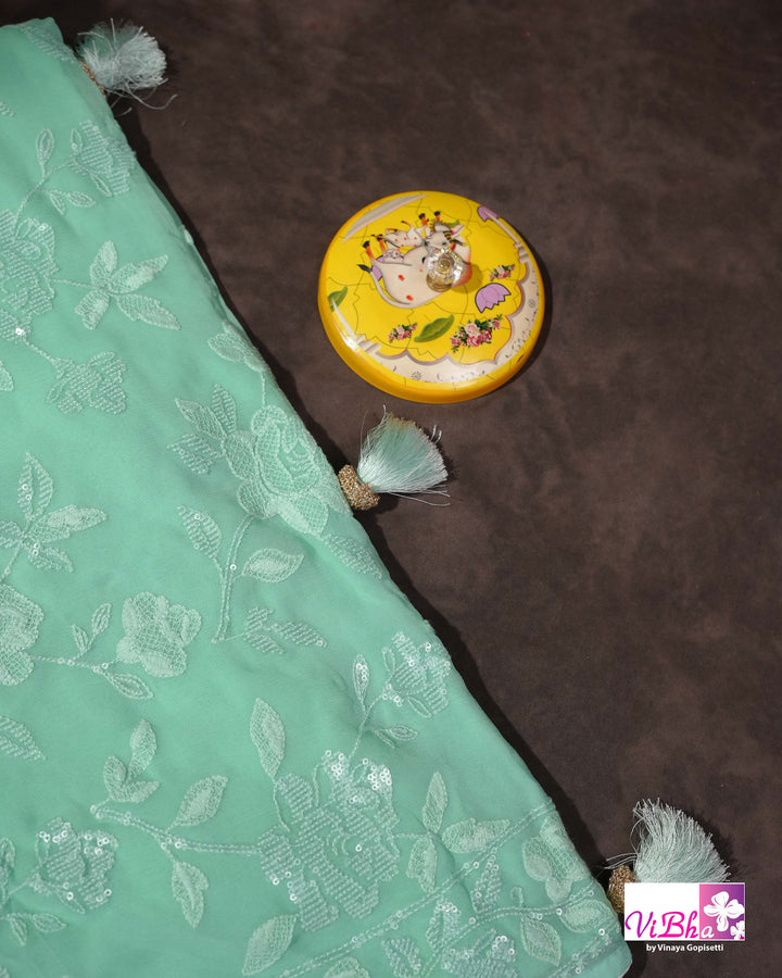 Mint Green Designer Saree with Tonal Floral Embroidery and Tassel Details