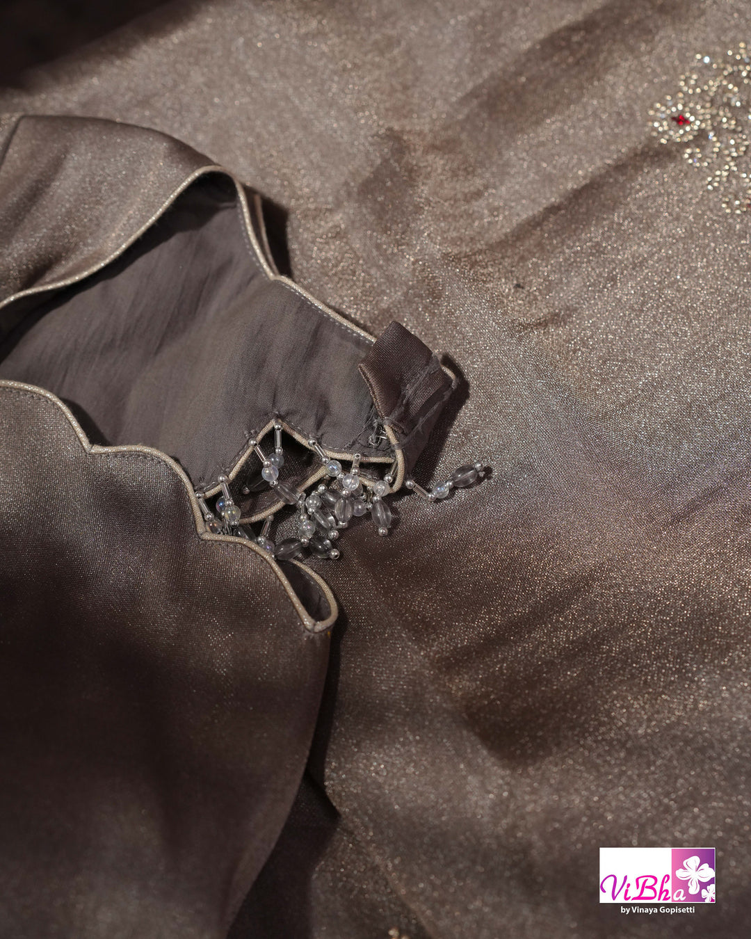 Taupe Shimmer Designer Saree with Ornamental Motifs and Scalloped Border