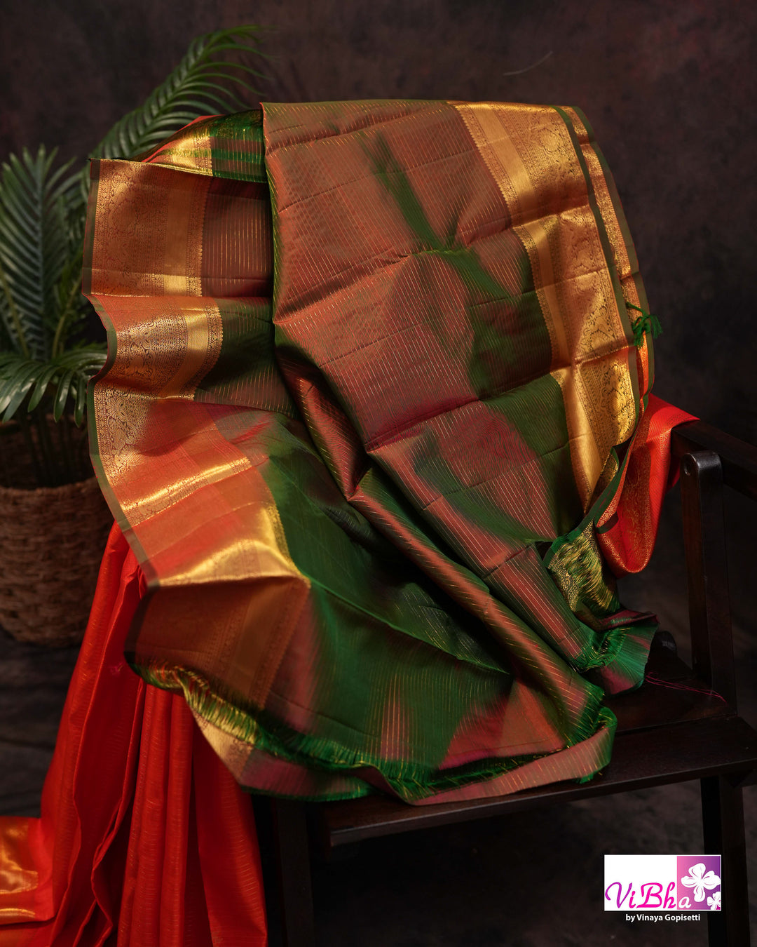 Vermilion Orange Kanchi Silk Saree with Gold Zari Weaving and Green Embroidered Blouse