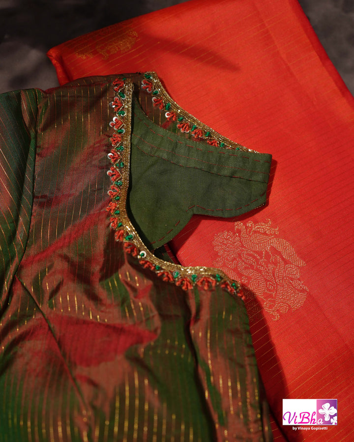 Vermilion Orange Kanchi Silk Saree with Gold Zari Weaving and Green Embroidered Blouse