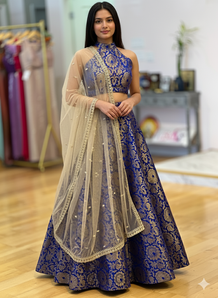 Blue Banarasi Silk Brocade Lehenga With Halter Neck Blouse And Gold Dupatta