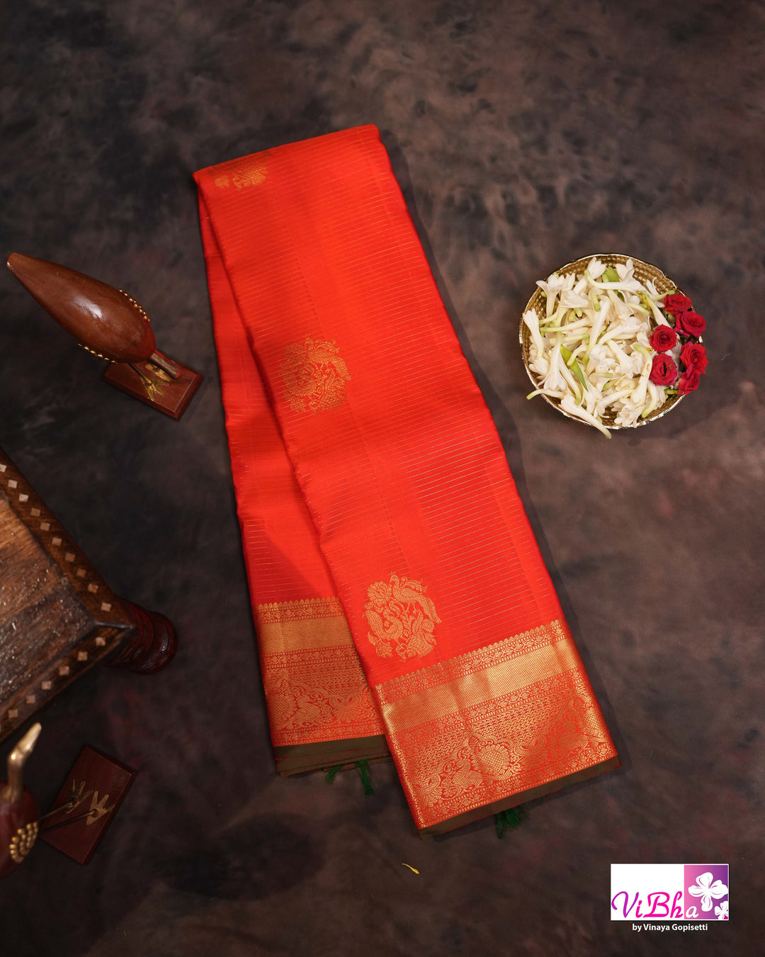Vermilion Orange Kanchi Silk Saree with Gold Zari Weaving and Green Embroidered Blouse