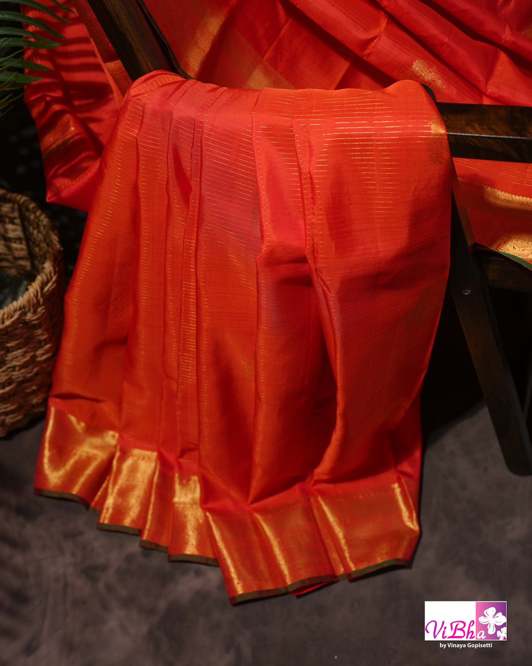 Vermilion Orange Kanchi Silk Saree with Gold Zari Weaving and Green Embroidered Blouse