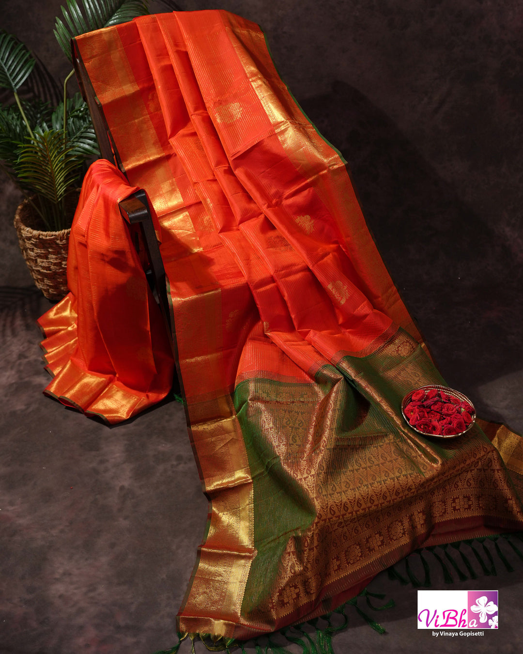 Vermilion Orange Kanchi Silk Saree with Gold Zari Weaving and Green Embroidered Blouse