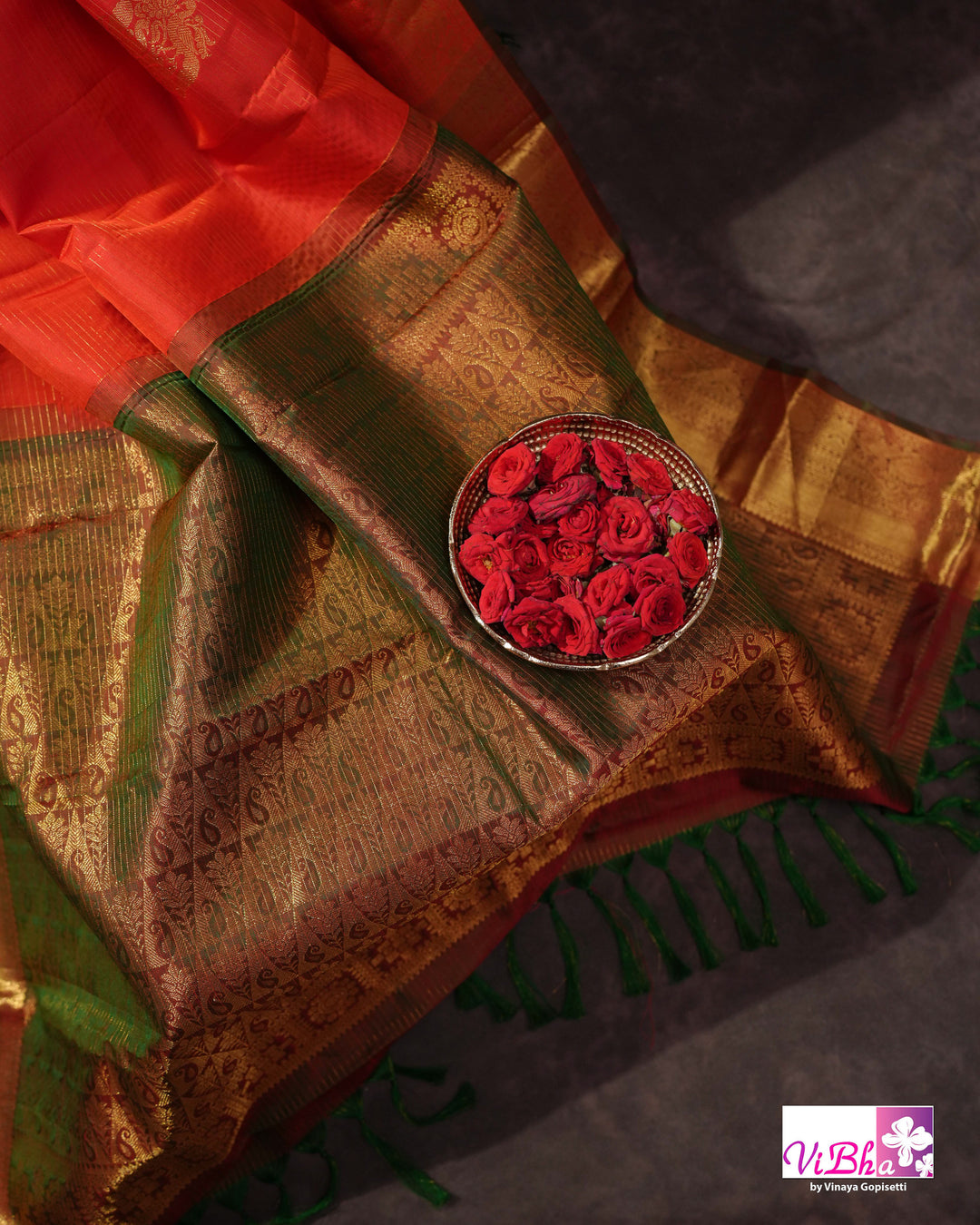 Vermilion Orange Kanchi Silk Saree with Gold Zari Weaving and Green Embroidered Blouse