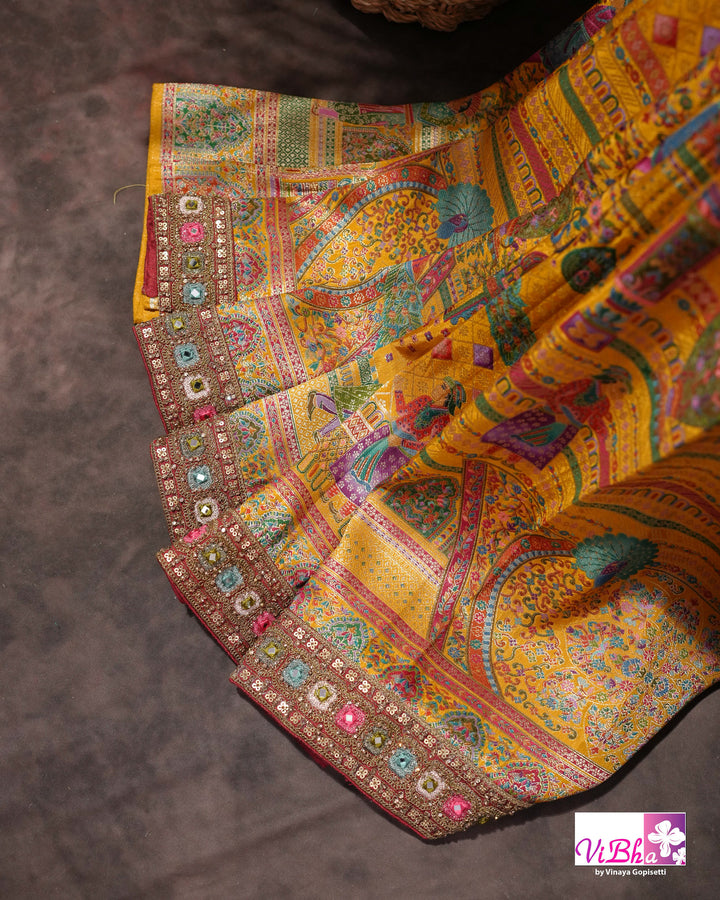 Mustard Yellow Designer Saree with Multicolour Figurative Motifs and Ornate Border