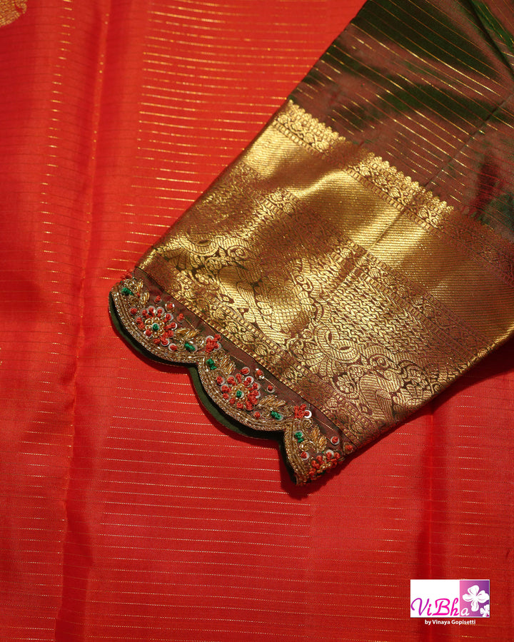 Vermilion Orange Kanchi Silk Saree with Gold Zari Weaving and Green Embroidered Blouse
