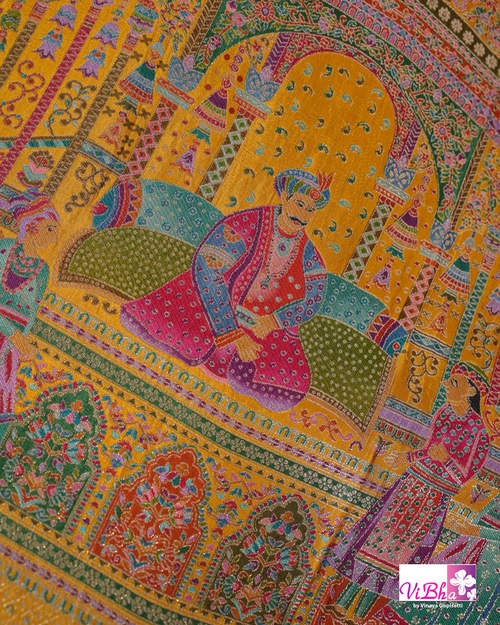 Mustard Yellow Designer Saree with Multicolour Figurative Motifs and Ornate Border