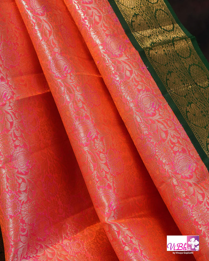 Coral Pink Kanchi Silk Saree with Floral Woven Design and Forest Green Gold Border