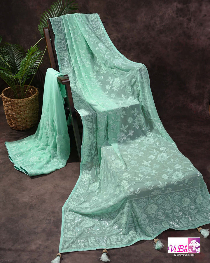Mint Green Designer Saree with Tonal Floral Embroidery and Tassel Details