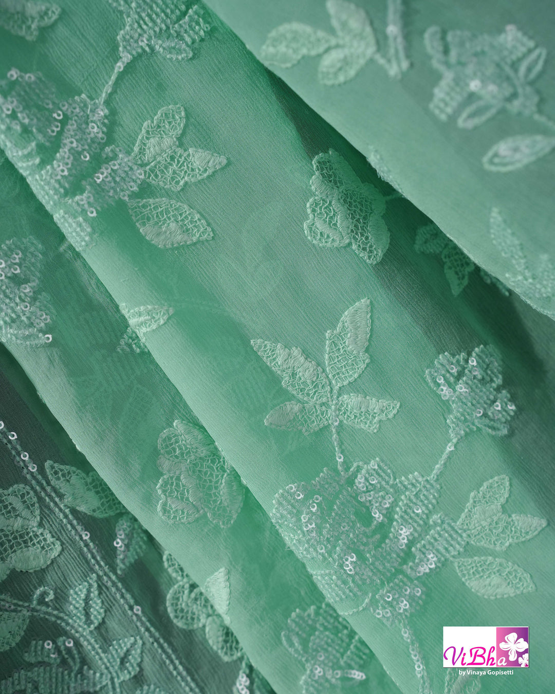 Mint Green Designer Saree with Tonal Floral Embroidery and Tassel Details