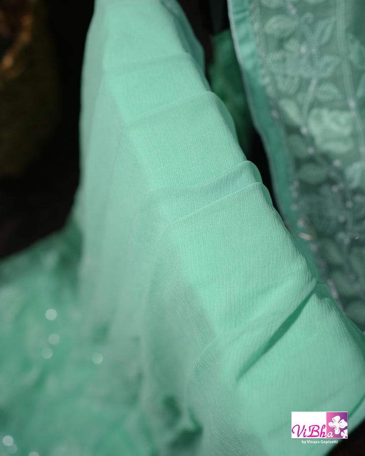 Mint Green Designer Saree with Tonal Floral Embroidery and Tassel Details