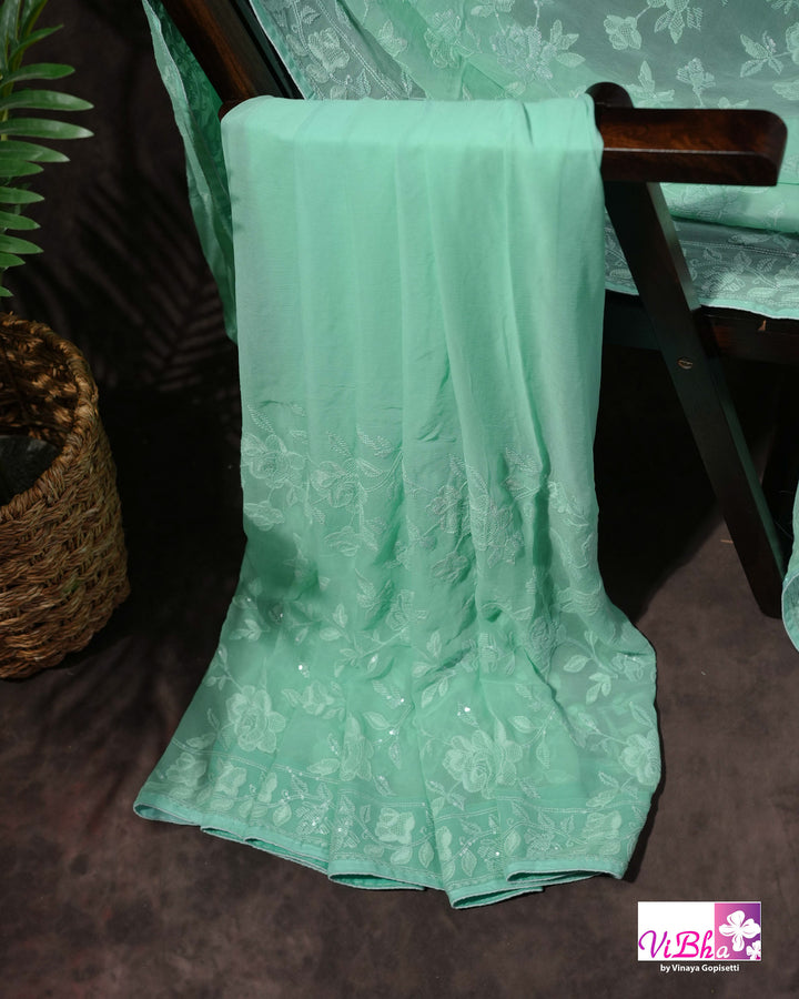 Mint Green Designer Saree with Tonal Floral Embroidery and Tassel Details