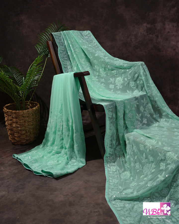 Mint Green Designer Saree with Tonal Floral Embroidery and Tassel Details