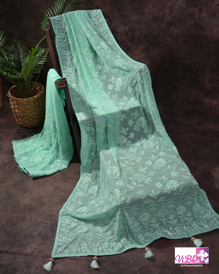Mint Green Designer Saree with Tonal Floral Embroidery and Tassel Details