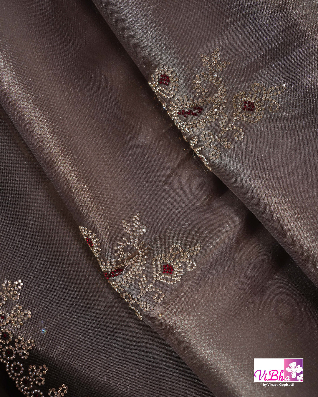 Taupe Shimmer Designer Saree with Ornamental Motifs and Scalloped Border