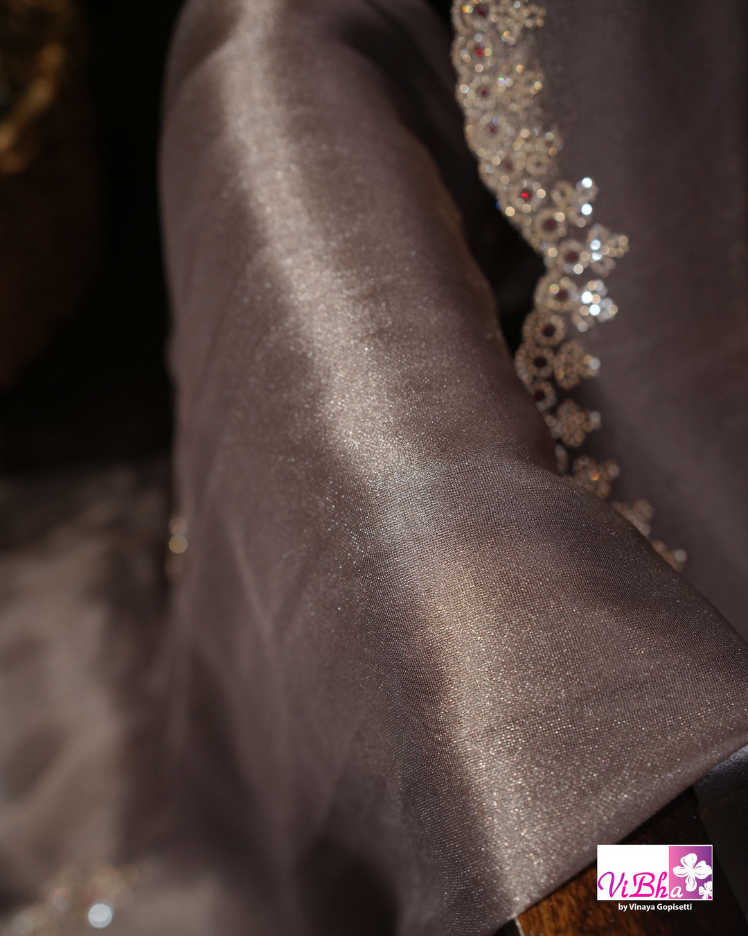 Taupe Shimmer Designer Saree with Ornamental Motifs and Scalloped Border