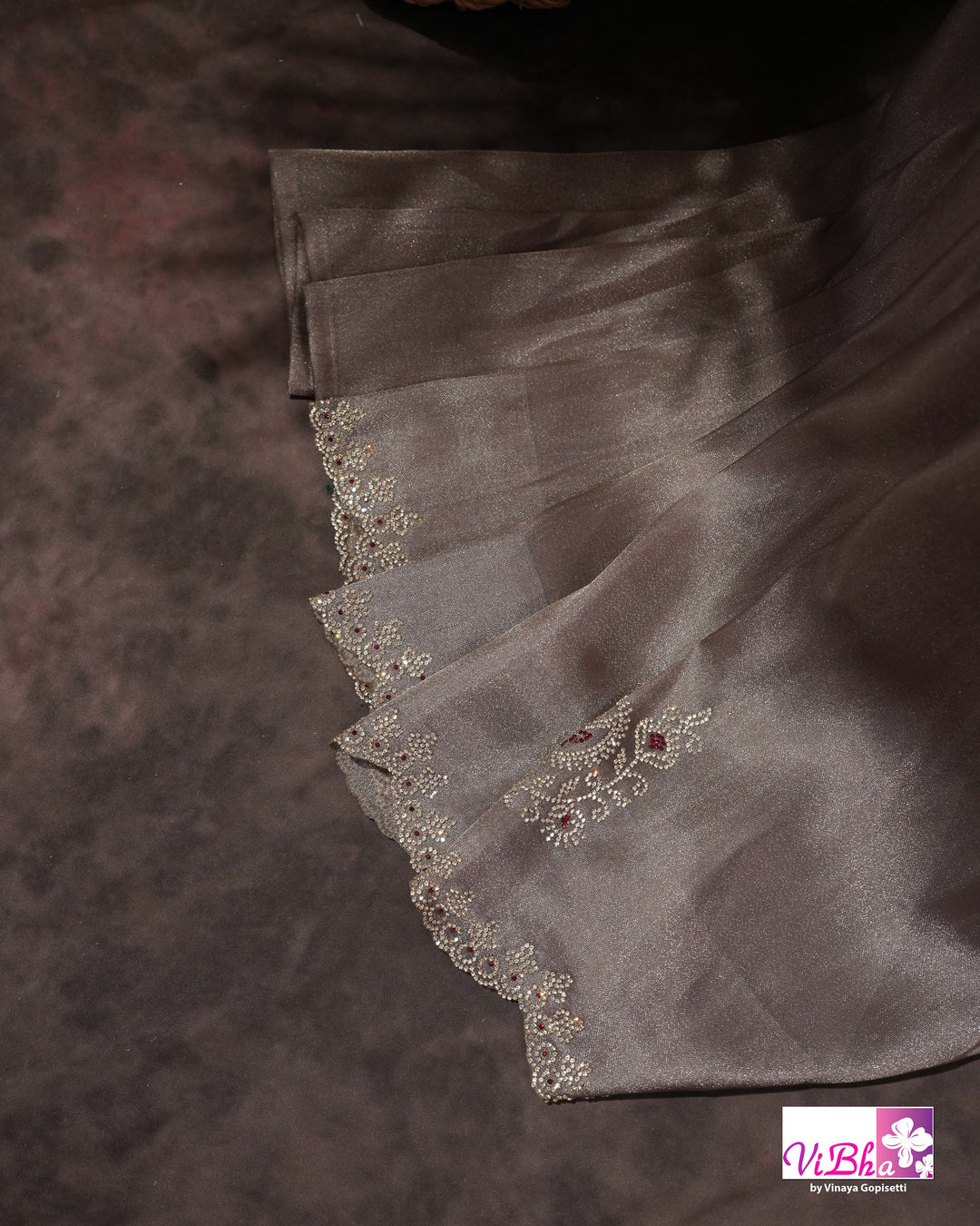 Taupe Shimmer Designer Saree with Ornamental Motifs and Scalloped Border