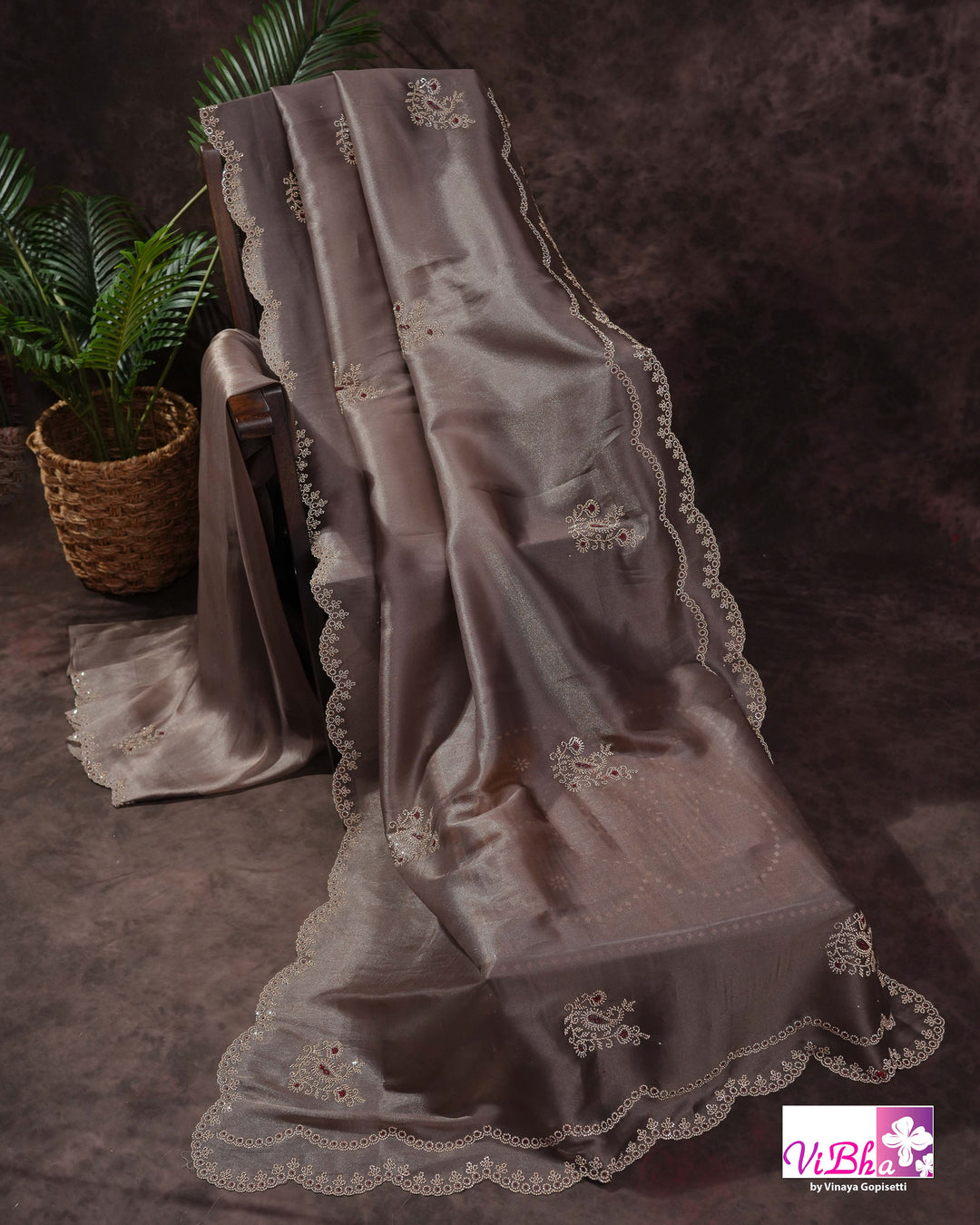 Taupe Shimmer Designer Saree with Ornamental Motifs and Scalloped Border
