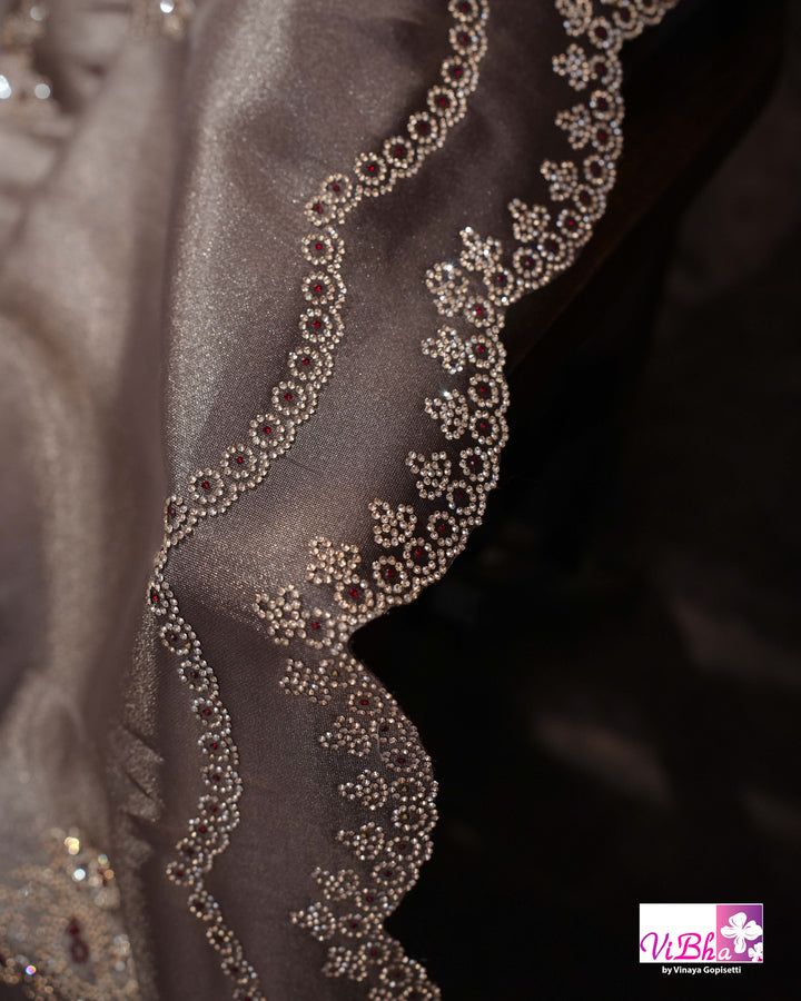 Taupe Shimmer Designer Saree with Ornamental Motifs and Scalloped Border