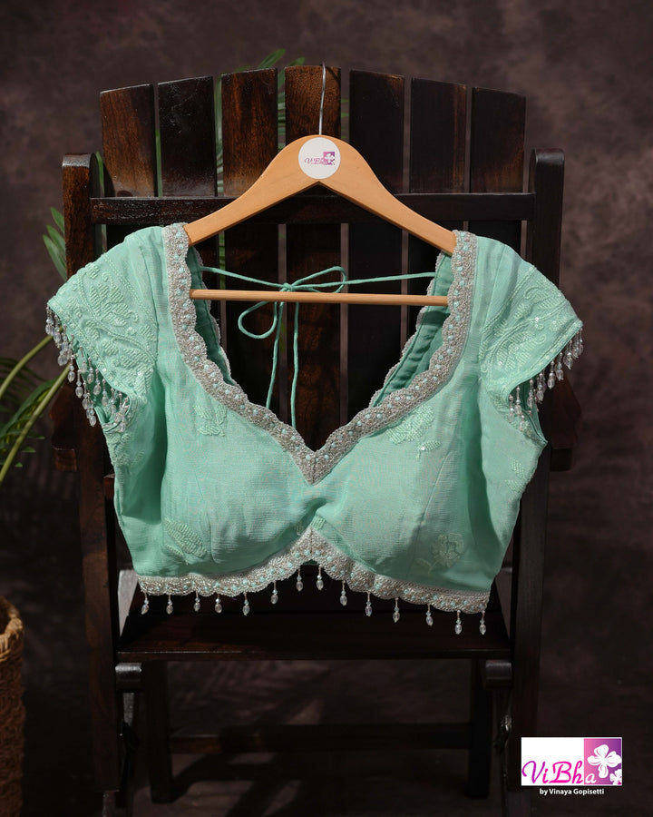 Mint Green Designer Saree with Tonal Floral Embroidery and Tassel Details