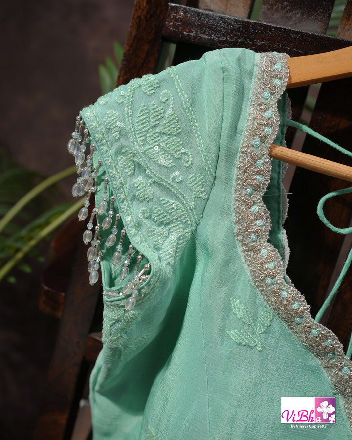Mint Green Designer Saree with Tonal Floral Embroidery and Tassel Details